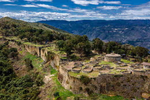 The hilltop stone fortress of Kuelap, built by the Chachapoya people, overlooks the Andean mountains of northern Peru. 