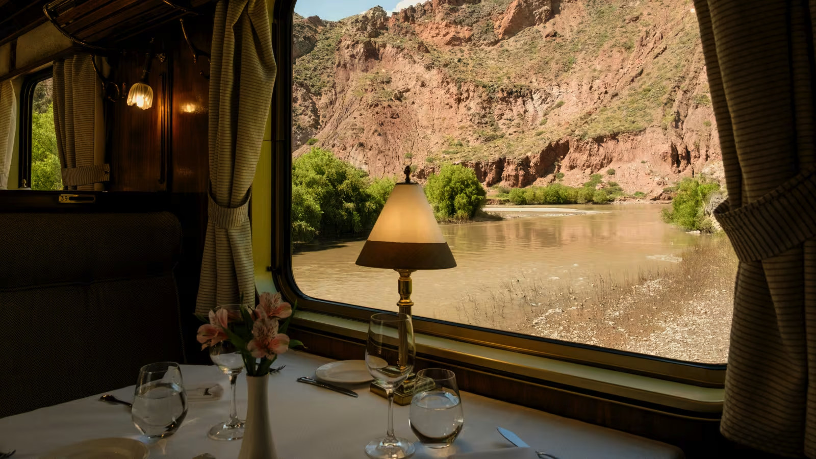 Scenic river and canyon views from the window of a luxury train to Machu Picchu, Peru. 