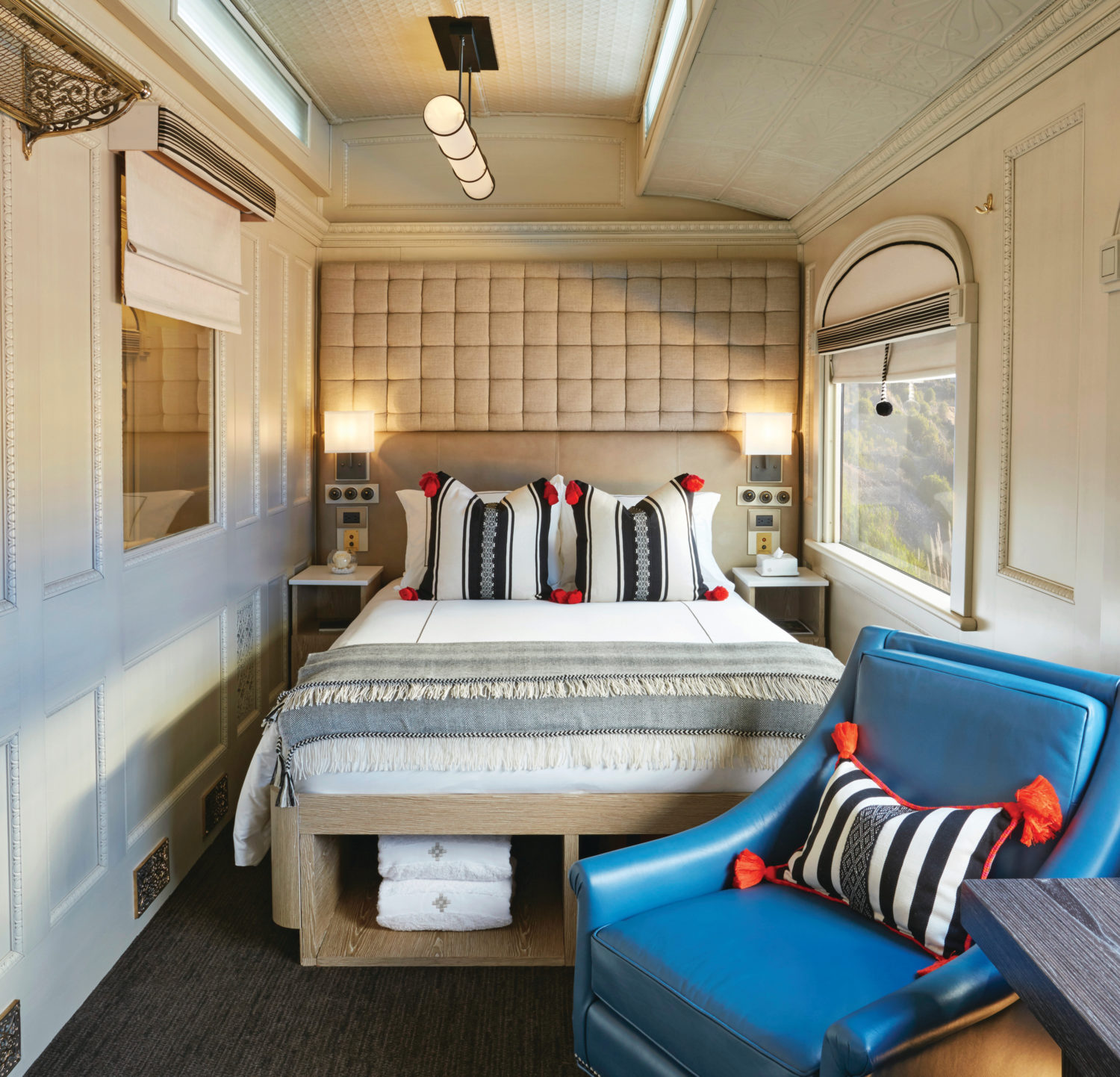 Junior double cabin aboard the Belmond Andean Explorer with scenic window views. 