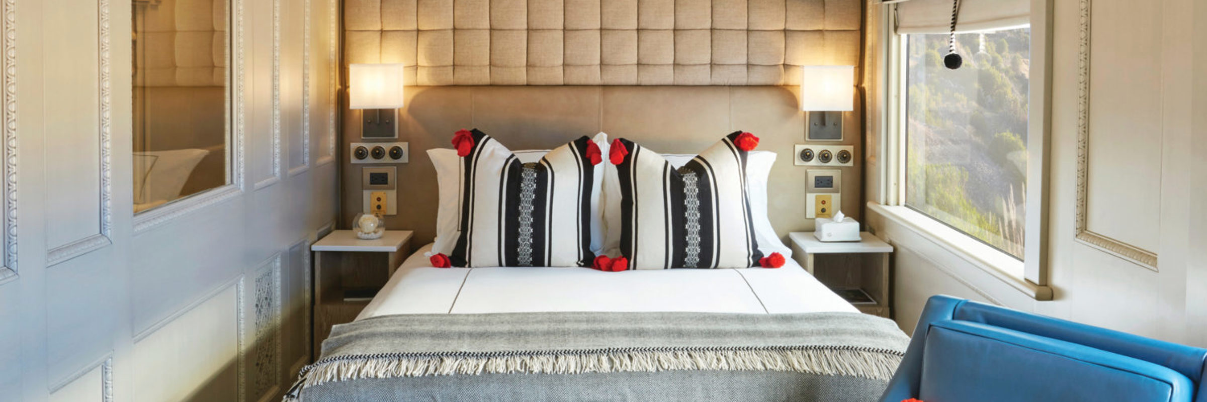 Junior double cabin aboard the Belmond Andean Explorer with scenic window views. 