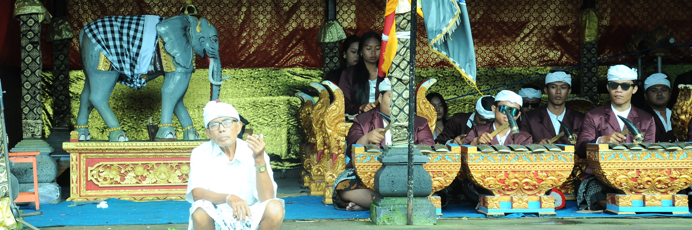 Traditional Balinese musicians perform a gamelan ensemble in ceremonial dress in Bali, Indonesia. 